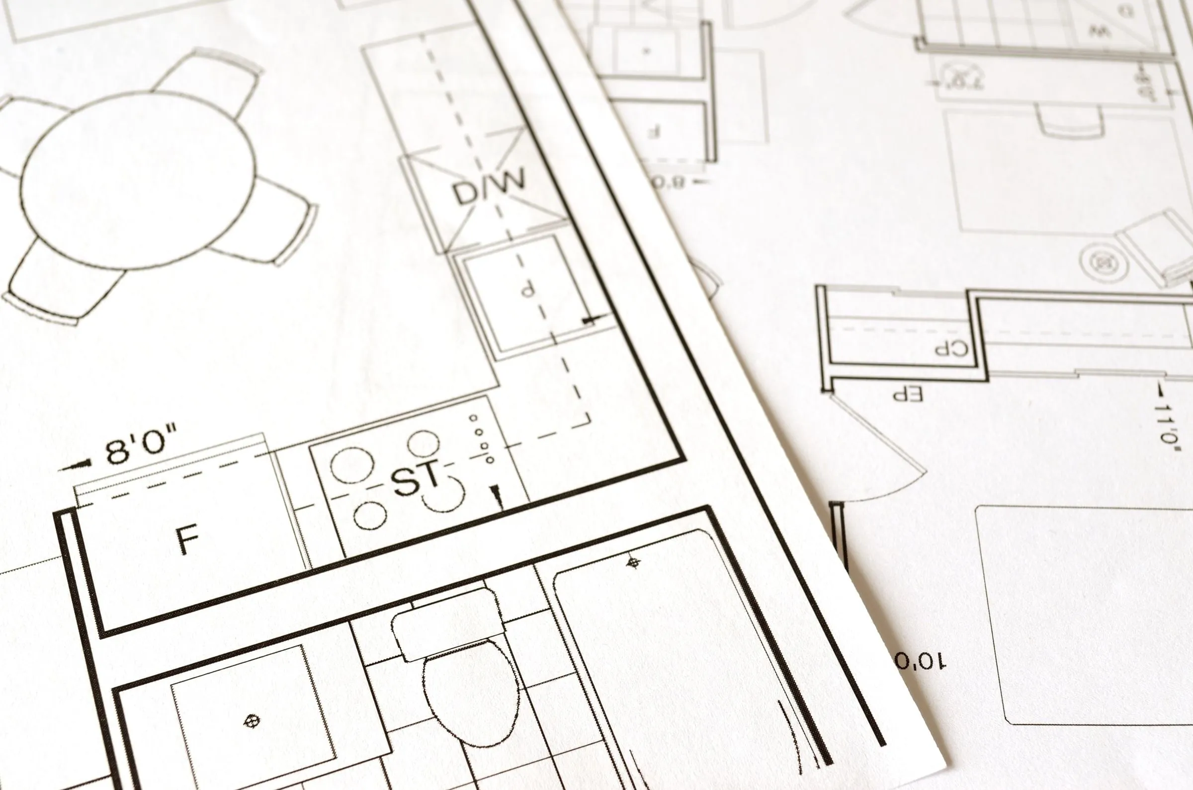 A printed floor plan with room layouts and measurements